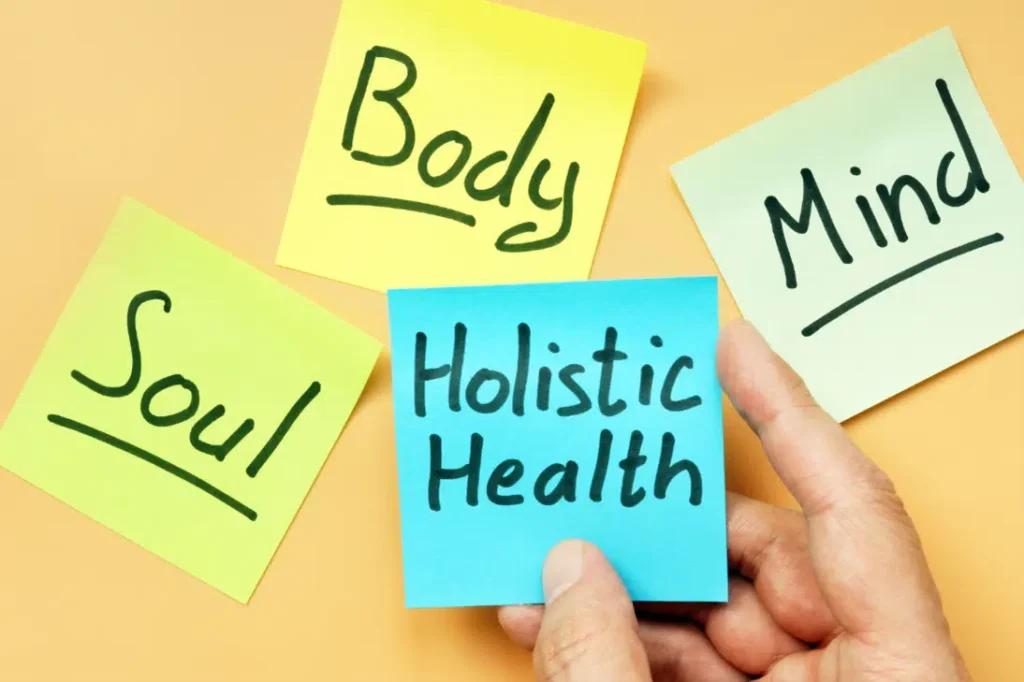 Sticky notes labeled mind, body, soul, and holistic health, illustrating holistic wellness for True REST Float Spa